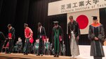 Image of students in ceremonial gown during a graduation ceremony