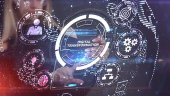 An abstract image with a women touching a screen and a digital imagery popping up in the air with circular symbols of digital transformation