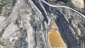 Aerial view of an open-pit mining site.