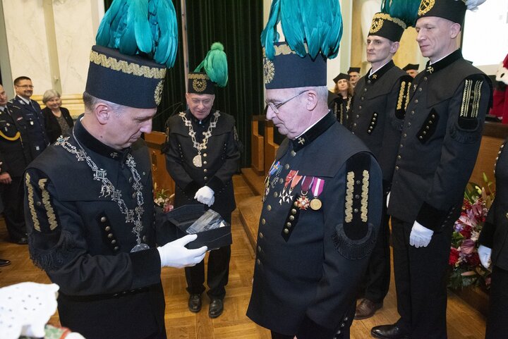 A decorative image of a mining ceremony