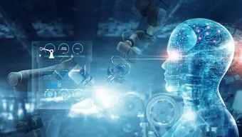 This is an image showing a futuristic concept where artificial intelligence (AI) and robotics are integrated. It depicts a digital human figure with a transparent head, showcasing circuits and neural-like patterns, symbolizing AI. Surrounding it are robotic arms and technological elements, representing automation and machinery, likely within an industrial or high-tech setting.