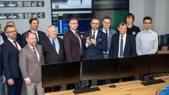 Image of a group of men posing for a photo in the advanced MXene in LEO Lab