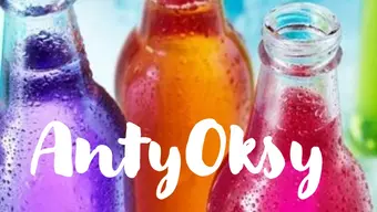 Glass bottles with colorful drinks with the name "antyoksy" written in the front with the use of a playful font in white