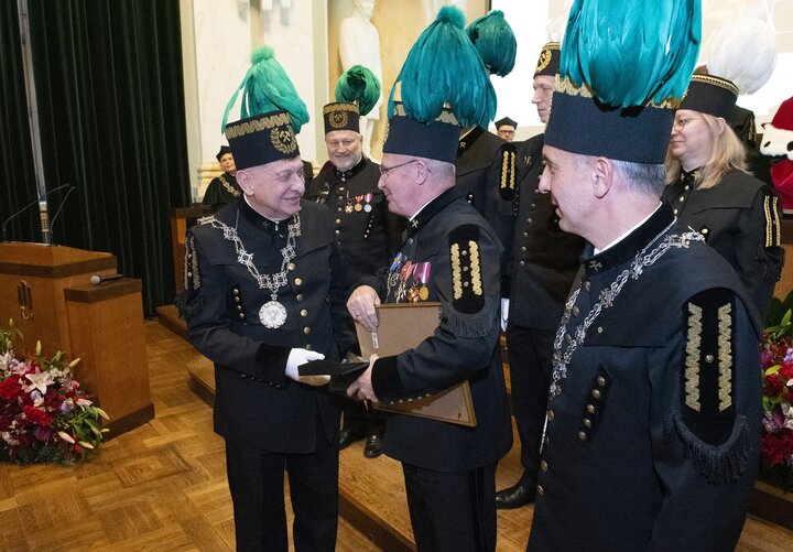 A decorative image of a mining ceremony