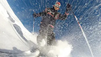 A creative photograph of a skier from below.