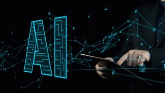 Grafika dekoracyjna. Po lewej stronie widoczny duży, świecący napis ‘AI’ otoczony siecią połączonych linii i ikon symbolizujących technologię, dane oraz sztuczną inteligencję. Z prawej strony dłoń trzymająca tablet, druga dłoń wskazuje palcem na ekran tabletu.