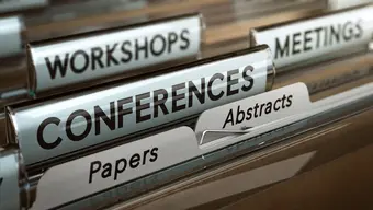 Grafika dekoracyjna: kartoteka z zakładkami oznaczonymi hasłami „Conferences”, „Workshops”, „Meetings”, „Papers” i „Abstracts”.