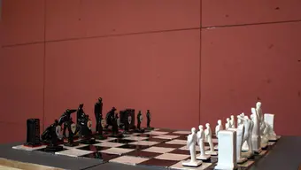 image of a chess set on a red background