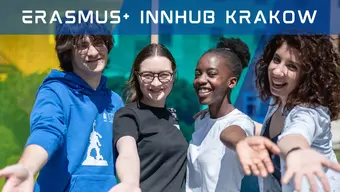 An image of a diverse group of four students smiling and holding out their hands. The words "Erasmus+ Innhub Krakow" written in a futuristic font in the upper part of the image.