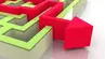 A decorative image of a red arrow escaping a green maze..