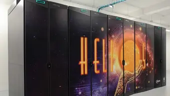 The supercomputer Helios consists of several server cabinets and is adorned with an image of a hand holding the Sun.