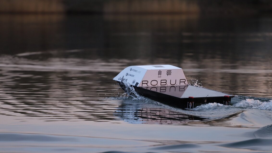The autonomous boat on the surface of water.