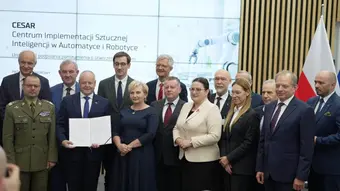 Group photo of signatories to the agreement establishing CESAR, with the signed document displayed and the project logo visible in the background.