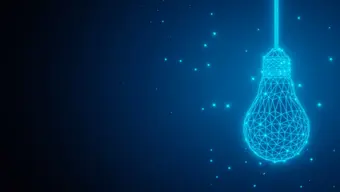 Glowing wireframe light bulb suspended in a dark, starry digital background