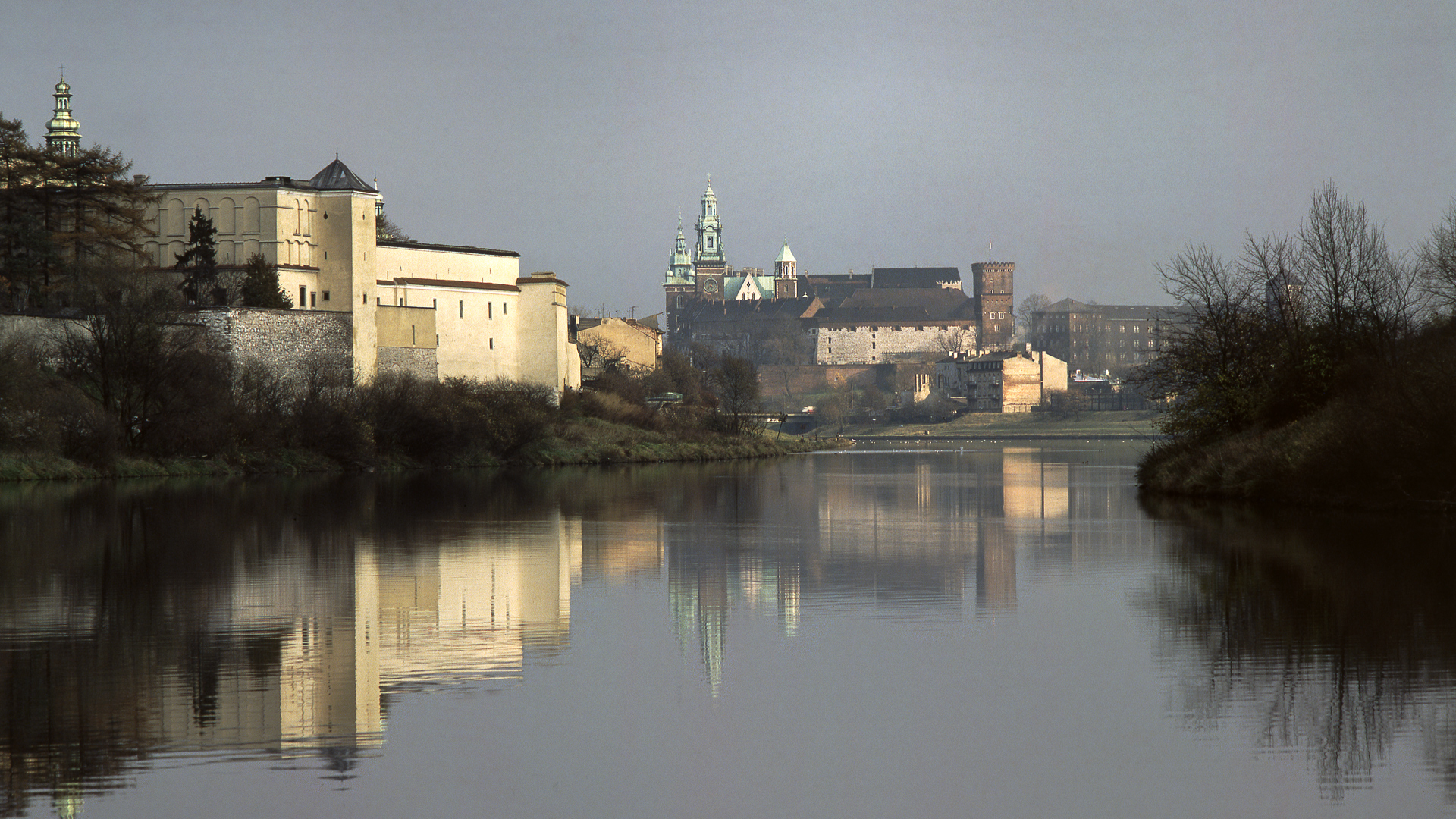 Photo of a mediaeval castle on a river bank.